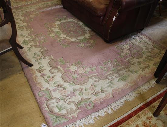 Pink ground Indian rug and a smaller rug